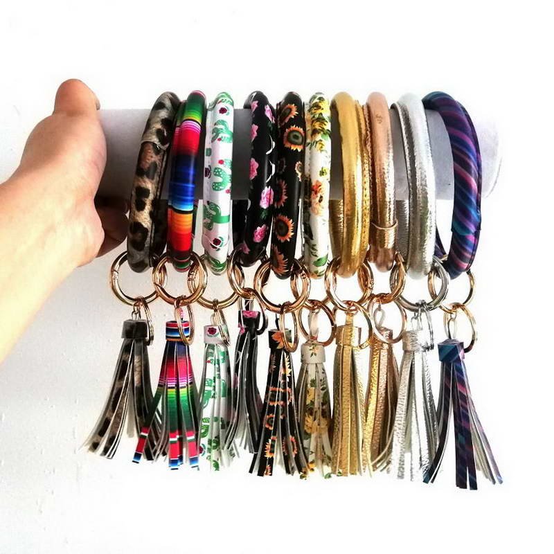 Elevate Your Key Game with Our Leather O Circle Tassel Wristlet